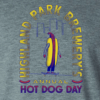 heather grey annual hot dog day tshirt detail hot dog man riding a skateboard with Highland park brewery annual hot dog day text