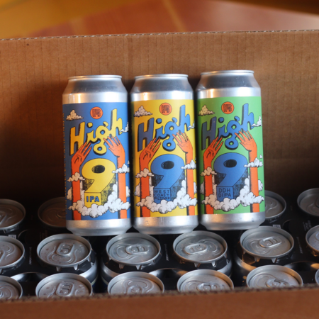 The three high 9 cans in a shipping case.