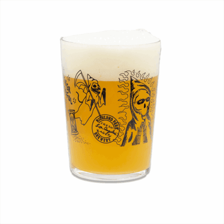 A Forever Grateful Maxi Tumbler filled with hazy golden beer and a foamy head, featuring black illustrations like a grim reaper, a sun figure, and the text "Lachland Fresh Lager Brewery.
