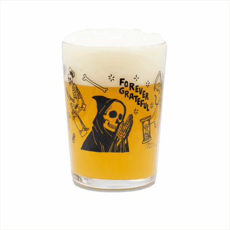 The Forever Grateful Maxi Tumbler features playful black illustrations of skeletons, a grim reaper, bones, an hourglass, and the phrase "FOREVER GRATEFUL," perfect for enjoying your favorite beer with a thick foamy head.