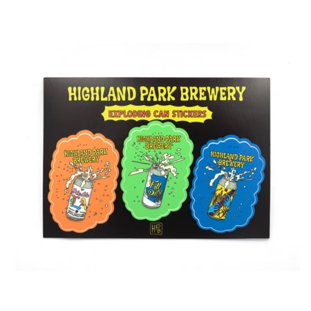 The Exploding Can Sticker Sheet from Highland Park Brewery features three colorful stickers of cartoon cans bursting with foam, displayed on a black card with yellow text.