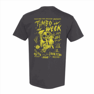 The Timbo Week 2025 Tee is a dark gray T-shirt with a bright yellow "Timbo Week 2025 July 7th-13th" graphic, featuring a cartoon skeleton in glasses, event details, lightning bolts, and "Highland Park Brewery Unleashes.