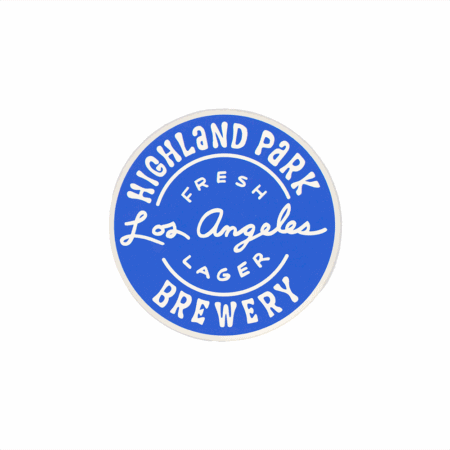 A 2-pack of round blue stickers featuring white handwritten-style text: “Highland Park Brewery, Fresh Los Angeles Lager.” Product: Fresh LA Lager - Blue Circle Sticker.