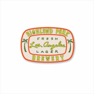 A rounded rectangular patch with orange trim displays "Fresh Los Angeles Lager" from Highland Park Brewery in yellow and green text, featuring a palm tree on each side.