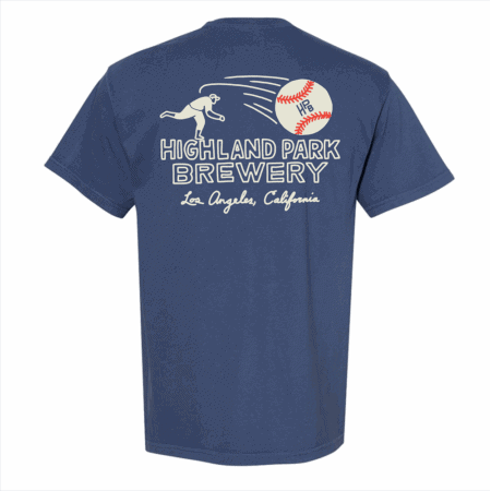 The HPB Baseball Tee is a navy blue t-shirt featuring a bear pitching a baseball and "Highland Park Brewery, Los Angeles, California" on the back.
