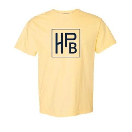 The HPB Logo Tee - Yellow is a light yellow t-shirt with a bold navy blue "HPB" monogram inside a square on the center chest.
