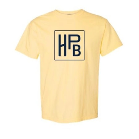 The HPB Logo Tee - Yellow is a light yellow t-shirt with a bold navy blue "HPB" monogram inside a square on the center chest.