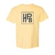 The HPB Logo Tee - Yellow is a light yellow t-shirt with a bold navy blue "HPB" monogram inside a square on the center chest.