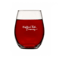 A clear Sad Cat Stemless Wine Glass (Set of 2) filled with red liquid, featuring "Highland Park Brewery" printed in white script on the front.