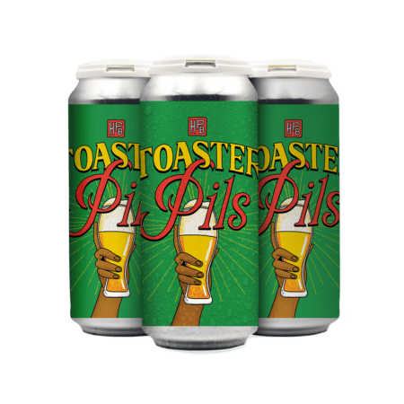 Three cans of beer with green labels reading "Toaster Pils." The label shows two hands, one light-skinned and one dark-skinned, clinking golden beer glasses together. The background is bright green with yellow accents.
