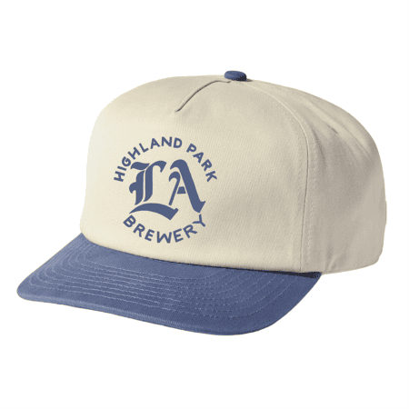 A beige HPB LA baseball cap with a blue brim and button, featuring "Highland Park Brewery LA" in blue on the front.