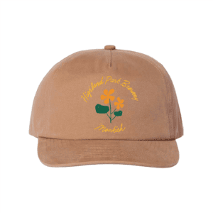 A tan baseball cap featuring yellow and green floral artwork with the words "Highland Park Brewery" and "Monkish" embroidered on the front in yellow and green text.