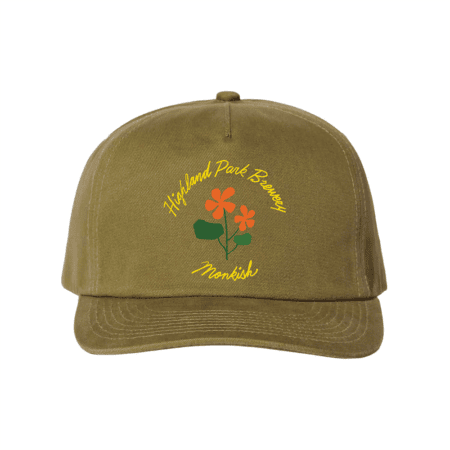Olive green baseball cap with "Highland Park Brewery" and "Monkish" written in yellow script above and below an orange flower graphic on the front.