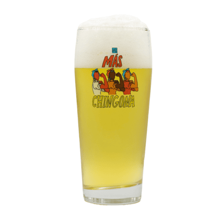 The Mas Chingona Tumbler is a tall glass featuring colorful cartoon illustrations and the phrase "Más Chingona," perfect for serving light beer with a foamy head.