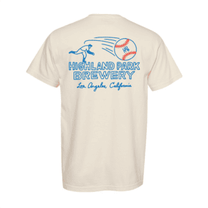 The HPB Baseball Tee is a cream-colored shirt featuring a blue line drawing of a baseball pitcher and "Highland Park Brewery, Los Angeles, California" text on the back.