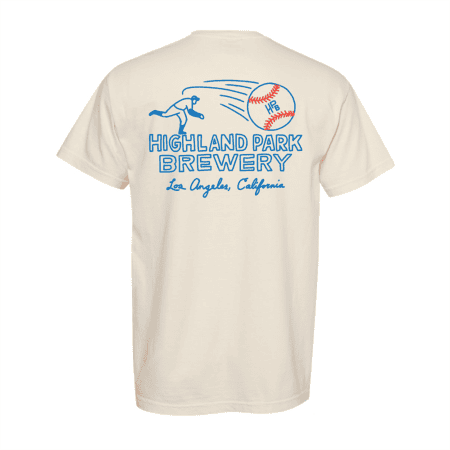 The HPB Baseball Tee is a cream-colored shirt featuring a blue line drawing of a baseball pitcher and "Highland Park Brewery, Los Angeles, California" text on the back.