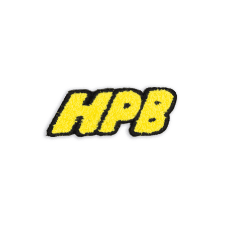 The HPB Futbol Patch features yellow textured "HPB" letters outlined in black, set against a white background.