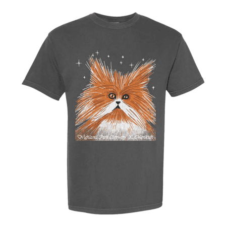 The HPBxMonkish Cat Friendly Tee is a dark gray shirt with an illustrated fluffy orange and white cat with wide eyes, surrounded by white stars. “Highland Park Brewery X Monkish” is printed below the cat.