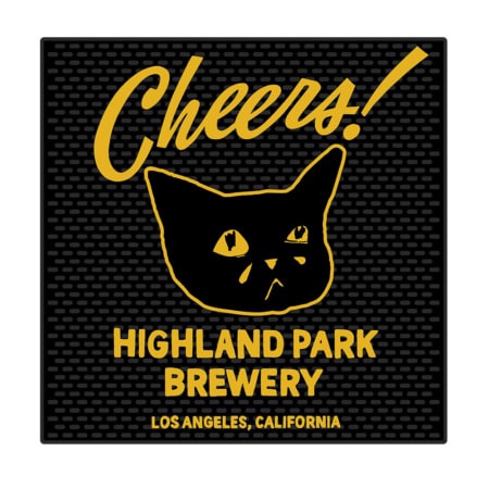 A black square bar mat featuring yellow text that says "Cheers!" above a sad cat’s face, with "Highland Park Brewery, Los Angeles, California" printed underneath. Product name: HPB Sad Cat Cheers! Bar Mat.