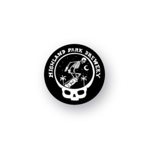 A round black logo for the "Timbo Week Pin 2026" features "Highland Park Brewery" in white text. A skeleton skateboards under a crescent moon, surrounded by stars and palm trees, with a white skull outline forming the lower border.
