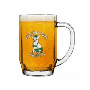 A glass beer mug filled with golden beer features a cartoon dog wearing a green scarf and the words “Dunkel Stein” on the front.