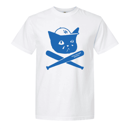 Sad Cat Bats Tee: White t-shirt featuring a blue graphic of a cat wearing a baseball cap with “LA,” sitting above two crossed baseball bats—one labeled “Highland Park Security.”.