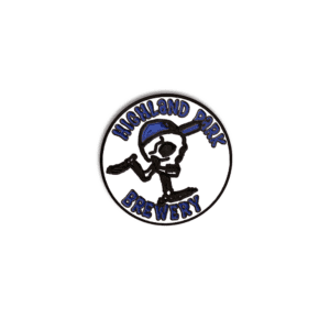 A round logo for Highland Park Brewery showcasing the “Skull Dude” character—a cartoon skeleton wearing a blue cap and shoes, running—with the brewery’s name in blue around the edge, as seen on the Skull Dude Enamel Pin.